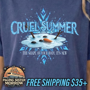 May include: A navy blue t-shirt features the text "CRUEL SUMMER" in a light blue, icy font. Below, a graphic depicts a melting snowman with a carrot nose and stick arms. The phrase "THE SHAPE OF YOUR BODY, IT'S NEW" is below the graphic.