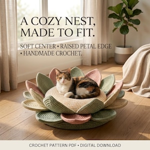 May include: A calico cat resting on a round, handmade crochet pet bed shaped like a flower with sage green and dusty pink petals. Text reads: A COZY NEST, MADE TO FIT. SOFT CENTER • RAISED PETAL EDGE • HANDMADE CROCHET. CROCHET PATTERN PDF • DIGITAL DOWNLOAD.