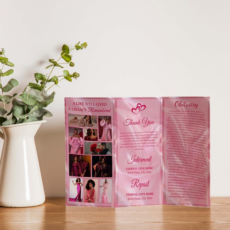 May include: A pink memorial tri-fold brochure with the text "A Life Well Lived, A Legacy Remembered" and "Thank You". The brochure includes photos and the words "Interment" and "Repast".