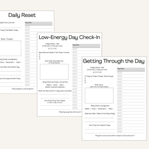 May include: Three white paper templates for daily journaling, each with prompts for self-reflection. The templates include sections for mood, goals, and body check-ins. The text includes "Daily Reset", "Low-Energy Day Check-In", and "Getting Through the Day".