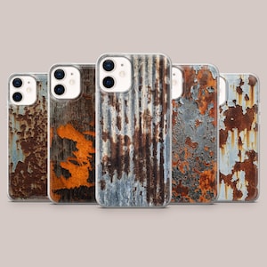 May include: A collection of five phone cases with a weathered, rustic design. Each case features a unique pattern of rust, peeling paint, and aged metal textures in shades of brown, orange, gray, and blue. The cases are designed to fit a smartphone.