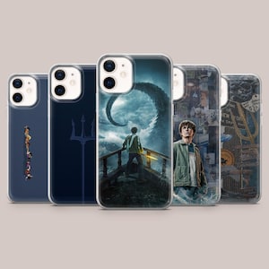 May include: Five clear phone cases, each with a different design. The cases display images such as a trident, a collage, and a scene of a person on a bridge with a sea monster. These cases are designed to fit a smartphone.