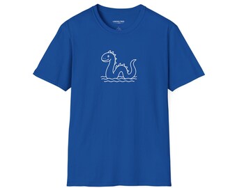 May include: Royal blue t-shirt featuring a white line drawing of a cartoon Loch Ness Monster swimming in water. The shirt has a crew neck and short sleeves. The brand name "Linden Tree" is printed on the tag.