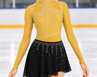 May include: A long-sleeved ice skating dress featuring a mustard yellow bodice with a high neck, cut-out shoulders, and intricate silver crystal embellishments. The skirt is black, asymmetrical, and adorned with sparkling silver crystals.