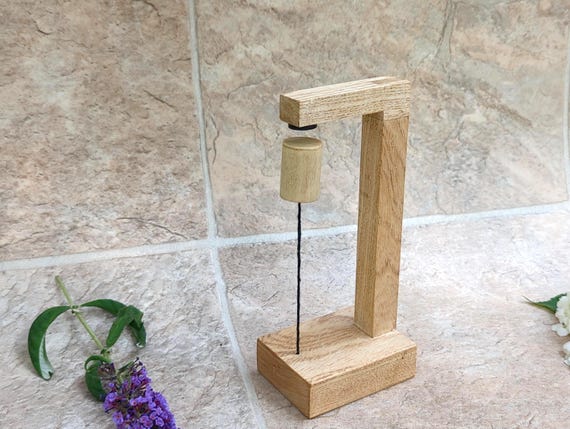 Handmade oak wood magnetic floating sculpture that creates a genuine optical illusion of defying gravity on your desk.