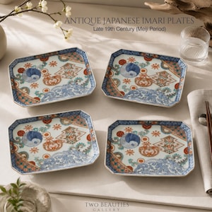 May include: Four rectangular ceramic plates featuring intricate blue, orange, and green patterns with wave and floral motifs. The text reads: ANTIQUE JAPANESE IMARI PLATES Late 19th Century (Meiji Period) and TWO BEAUTIES GALLERY. The plates have octagonal corners.