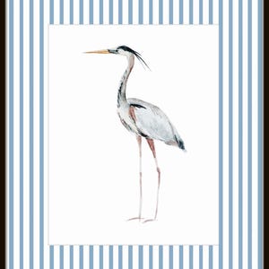 May include: A watercolor painting of a gray heron with a long, thin beak and long legs standing on a white background. The heron is framed by blue and white stripes.