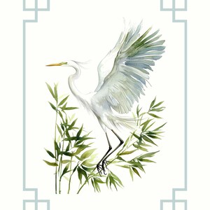 May include: Watercolor painting of a white egret with outstretched wings, perched among green bamboo leaves. The bird has a yellow beak and black legs. The artwork is framed with a light blue border on a white background. The style is reminiscent of Asian art.