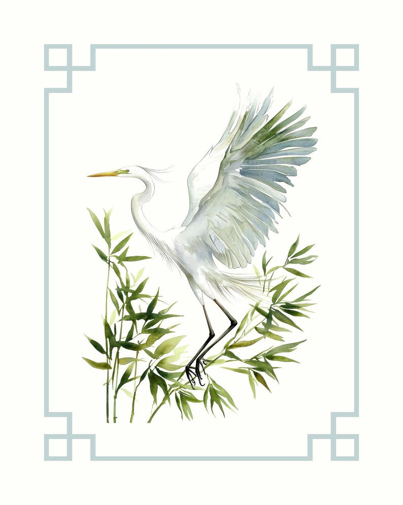 May include: Watercolor painting of a white egret with outstretched wings, perched among green bamboo leaves. The bird has a yellow beak and black legs. The artwork is framed with a light blue border on a white background. The style is reminiscent of Asian art.