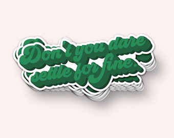May include: Green sticker with the text "Don't you dare settle for fine." in a retro font.