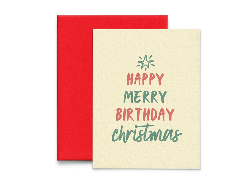May include: A cream-colored card with the text "Happy Merry Birthday Christmas" in green and pink lettering. The card has a red envelope.