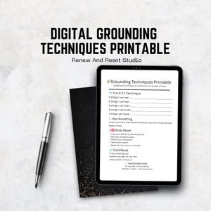 May include: A digital printable titled "DIGITAL GROUNDING TECHNIQUES PRINTABLE" with a black pen, a black and gold card, and a tablet displaying grounding techniques. The tablet shows the "5-4-3-2-1 Technique" and other methods for mindfulness.