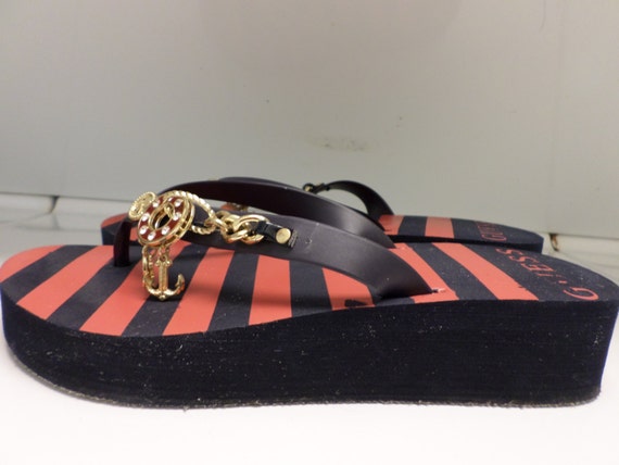 red guess flip flops