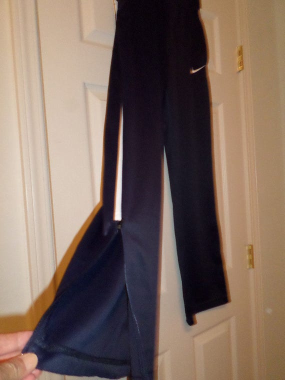 nike track pants zip leg