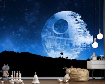 May include: A Star Wars-themed wall mural featuring the Death Star against a blue starry sky. Silhouetted figures and a black landscape are in the foreground. Decorative lights and a white nightstand are visible.