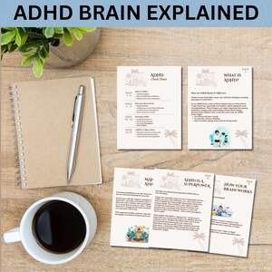 May include: A notebook, pen, and coffee cup sit on a wooden surface, with several informational pamphlets. The pamphlets have the text "ADHD Brain Explained" and "ADHD Cheat Sheet". The pamphlets have illustrations and text about ADHD.