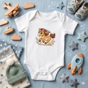 May include: White baby onesie featuring a cartoon horse illustration. The horse is brown with a flowing mane and tail, set against a backdrop of green leaves. The image is surrounded by wooden toys, star-shaped decorations, and baby shoes.