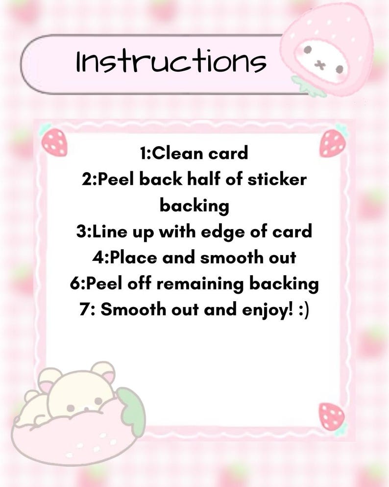 May include: A pink and white illustrated card with instructions for a sticker. The text reads "Instructions" at the top, followed by numbered steps. Strawberry and bear illustrations decorate the card.