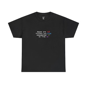 May include: Black t-shirt with the text "Roses are red violets are blue Unexpected '{' In line 32" in white, red, blue, and purple. The shirt has a crew neck and short sleeves.