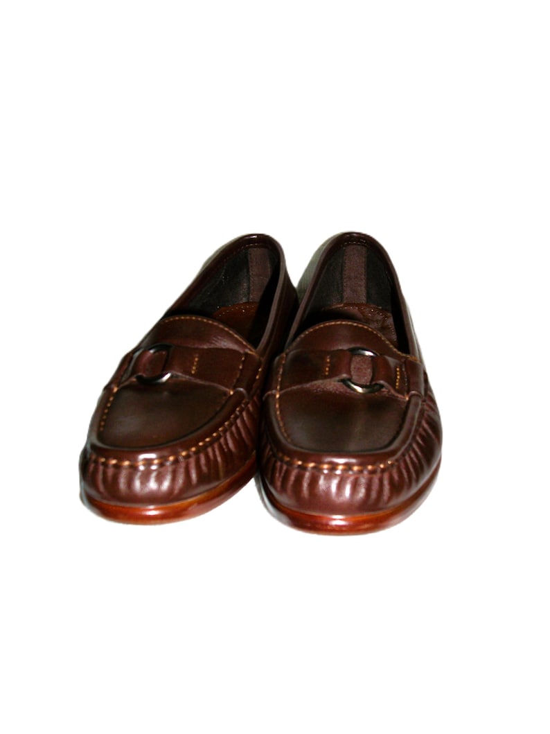 Vintage Ladies Brown Leather Loafers Slip Ons by SAS Size 5 Narrow Inside Toe/Heel equals 8 7/8 inches Leather upper, Rubber Soles Width at Ball is 3 inches Good- Vintage Condition Only 8 Dollars #shoes #womensshoes #size5shoes #leathershoes #brownshoes #Brownflats #size5narrow #size5flats #size5loafers #leatherloafers #madeinusa #madeinusashoes #brownslipons #leatherslipons #vintageshoes #vintageloafers #vintageflats #size5brownshoes #madeinusaloafers #loaferssize5 #SASshoes #SASloafers #SAS