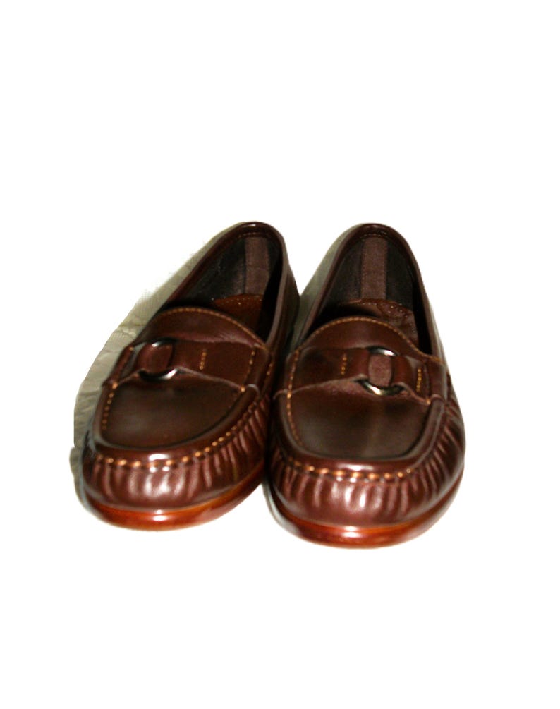 Vintage Ladies Brown Leather Loafers Slip Ons by SAS Size 5 Narrow Inside Toe/Heel equals 8 7/8 inches Leather upper, Rubber Soles Width at Ball is 3 inches Good- Vintage Condition Only 8 Dollars #shoes #womensshoes #size5shoes #leathershoes #brownshoes #Brownflats #size5narrow #size5flats #size5loafers #leatherloafers #madeinusa #madeinusashoes #brownslipons #leatherslipons #vintageshoes #vintageloafers #vintageflats #size5brownshoes #madeinusaloafers #loaferssize5 #SASshoes #SASloafers #SAS