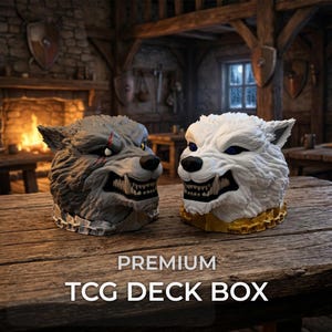 May include: Two wolf head TCG deck boxes, one grey with a silver collar and one white with a gold collar, both featuring bared teeth and detailed fur textures. The text PREMIUM TCG DECK BOX is displayed in white at the bottom of the image.