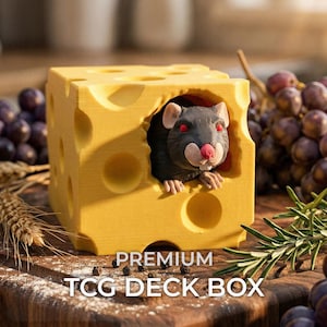 May include: A yellow cube-shaped deck box designed to resemble a block of Swiss cheese with holes, featuring a sculpted dark gray rat peering out from a side opening. The text PREMIUM TCG DECK BOX is printed in white at the bottom of the image.