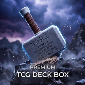 May include: A gray TCG deck box shaped like Thor's hammer with a brown handle and silver accents. The side features the engraved text: Whosoever holds this hammer, if he be worthy, shall possess the power of THOR. Text below reads: PREMIUM TCG DECK BOX.