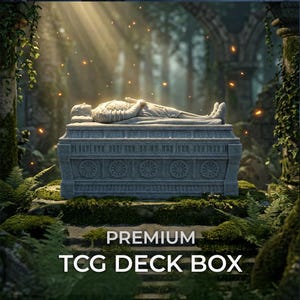 May include: A rectangular grey stone-textured TCG deck box featuring a sculpted effigy of a reclining figure on the lid. The sides are decorated with circular floral carvings. The text PREMIUM TCG DECK BOX is printed in white at the bottom.