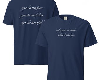 May include: Navy blue t-shirts with white text. One shirt displays "you do not fear, you do not falter, you do not yield" on the back. The other shirt reads "only you can decide what breaks you".
