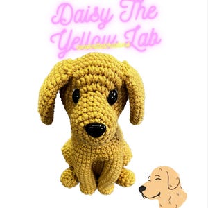 May include: A handmade, golden yellow crochet dog with black eyes and nose, sitting upright. The text "Daisy The Yellow Lab" is in pink cursive above the dog. A small, smiling dog illustration is to the right.