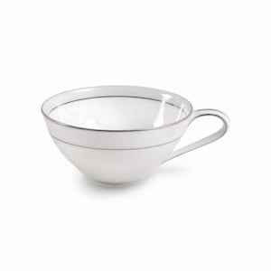 May include: A white teacup with a silver rim and handle. The cup has a simple, elegant design, with a thin silver line near the top and bottom. The cup is made of porcelain and is suitable for tea or coffee.