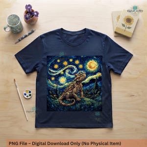 May include: A navy blue short-sleeve t-shirt featuring a graphic print of a bearded dragon lizard set against a swirling, starry night sky background with a crescent moon, rendered in a textured, painterly style with deep blues and bright yellows.