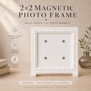 May include: A white square magnetic photo frame with a beaded border, featuring four circular magnetic points for holding 5.08 cm x 5.08 cm photo magnets. The frame includes text stating 2x2 MAGNETIC PHOTO FRAME, HOLDS FOUR 5.08 cm x 5.08 cm PHOTO MAGNETS, and details about magnets, positions, and display angles.