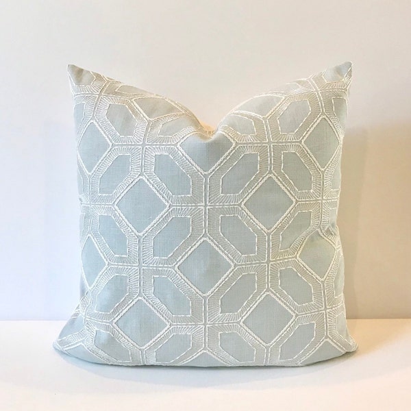 Light blue and white embroidered geometric trellis decorative pillow cover