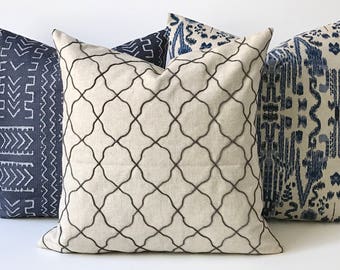 Charcoal gray and tan embroidered Moroccan quatrefoil geometric decorative pillow cover