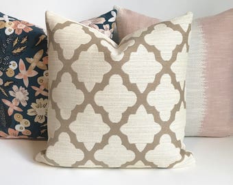 Tan and ivory morrocan quatrefoil geometric decorative throw pillow