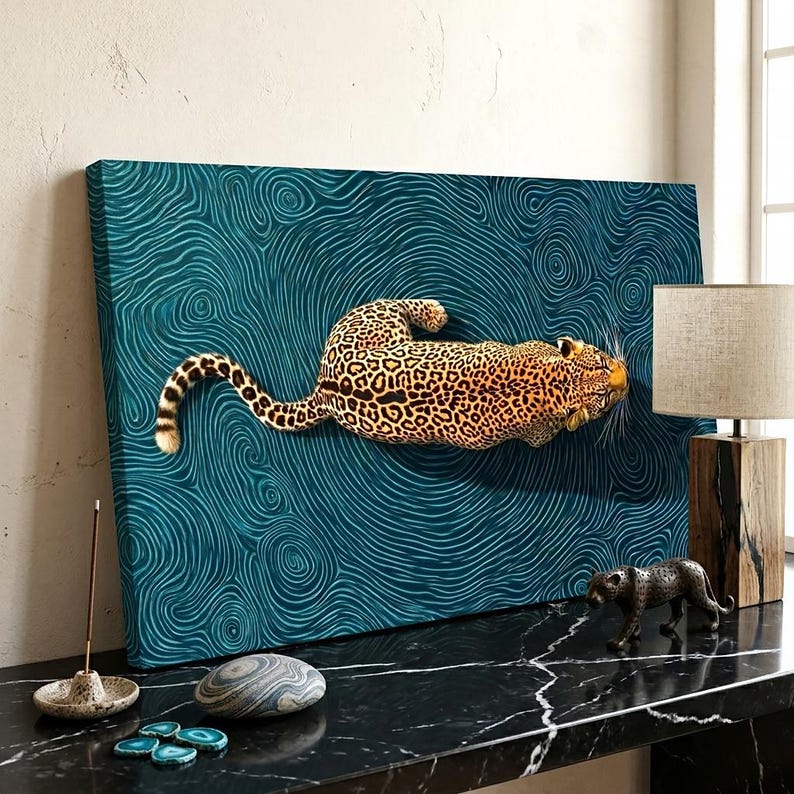 May include: A rectangular canvas wall art piece featuring a leopard in a horizontal position against a dark teal background with swirling, wave-like patterns. The leopard has a golden-brown coat with black spots and is oriented toward the right.