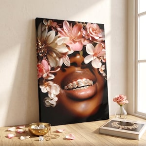 May include: A rectangular canvas print featuring a close-up of a dark-skinned face adorned with a crown of pink and white flowers. The subject has gold teeth grills on the upper and lower teeth. The background is black, highlighting the floral details.