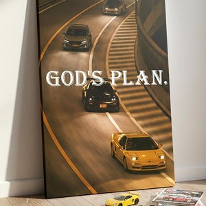 May include: A canvas print featuring a nighttime scene of several sports cars racing on a curved road. The text "GOD'S PLAN" is displayed in white. A yellow toy car, sunglasses, and magazines are on the floor.