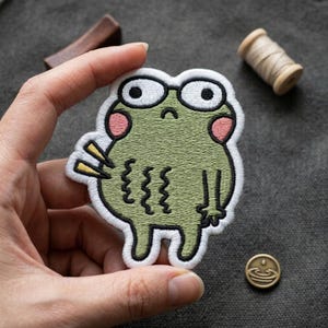 Cute Sad Frog Embroidered Patch | Funny Green Toad Iron On Patch | Aesthetic Animal Badge for Jacket Backpack Hat | Quirky Gift for Friend