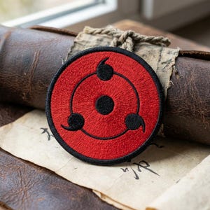 Red and Black Swirl Eye Patch, Embroidered Iron On Badge, Japanese Symbol Sew On Patches, Cool Gothic Gift for Jacket Backpack (126 chars)
