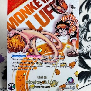 May include: A trading card featuring Monkey D. Luffy from the "Straw Hat Crew" with a Popeyes theme. The card has a red and orange color scheme, with the text "MONKEY.D.LUFFY" and "Popeyes" prominently displayed. The card also includes game instructions.