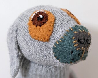 Grey wool glove dog. dog for lovers