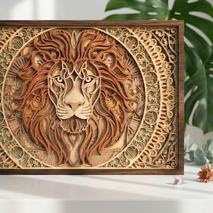 May include: A layered wooden artwork depicting a lion's head with a flowing mane. The artwork is framed in dark brown wood and features intricate patterns and textures in shades of brown and tan. The lion is centered within a circular design.
