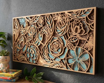 May include: A layered wooden wall art piece featuring a floral design with roses and other flowers in shades of brown, teal, and natural wood. The artwork is rectangular and has a three-dimensional effect.