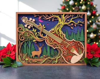 May include: A multi-layered wooden wall art piece featuring a violin integrated into a forest scene. The design includes a deer, pine trees, and swirling tree branches in shades of green, brown, and orange against a dark blue background.
