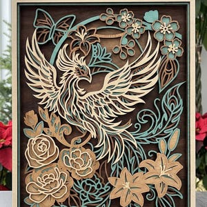 May include: A layered wooden art piece featuring a phoenix with outstretched wings, surrounded by flowers and foliage. The design incorporates shades of brown, beige, and teal, set within a rectangular frame. The words "Commercial License" are at the bottom.