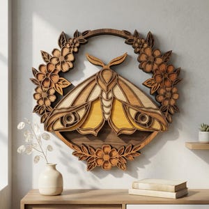May include: A layered wooden wall art piece featuring a moth design, surrounded by a floral wreath. The moth has a yellow and brown color scheme, with intricate details. The wreath and moth are made of wood, creating a natural, rustic aesthetic.