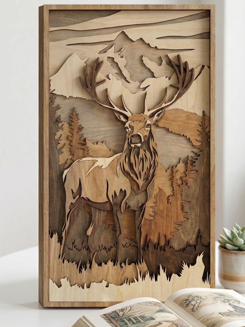 May include: A wooden wall art piece featuring a layered design of a majestic elk in a forest setting. The artwork showcases a mountain backdrop and detailed trees, all crafted from natural wood tones. The elk has large antlers.